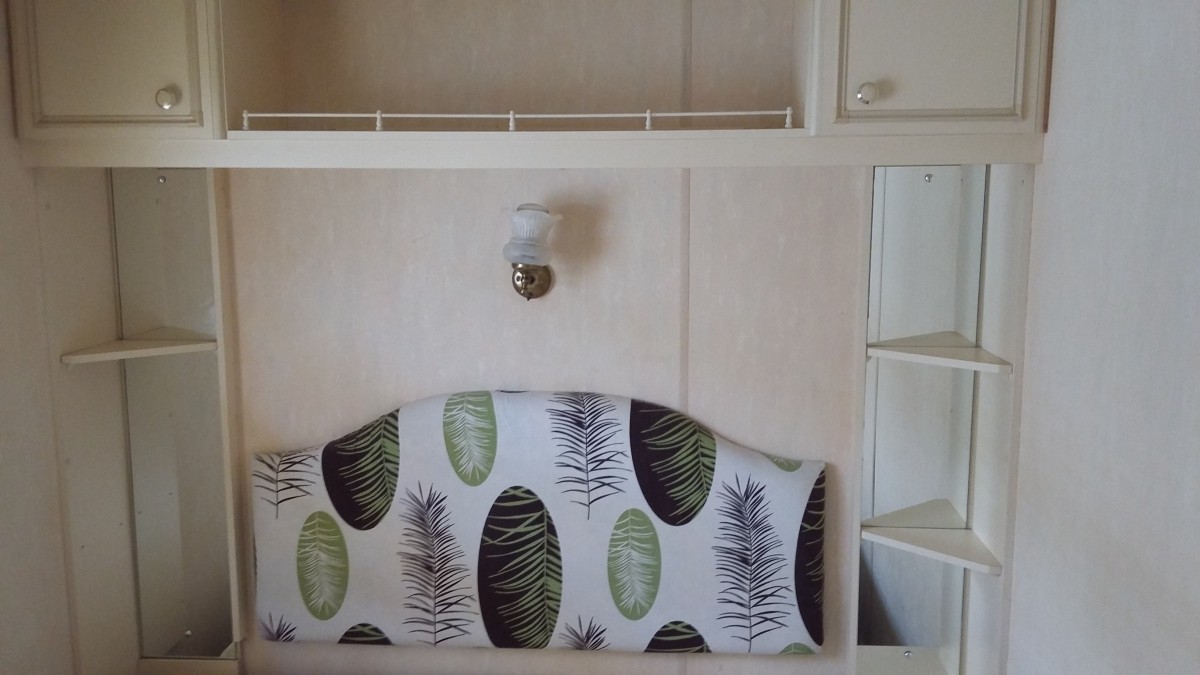 Tête de lit avec rangemets  mobil home occasion ABI Montrose 